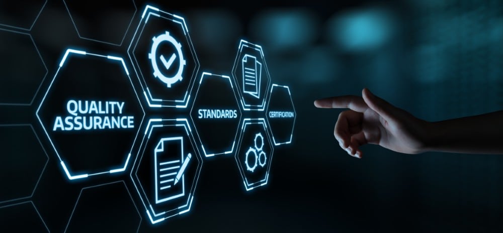 A hand points to glowing icons for quality assurance, standards, and certification on a digital screen.